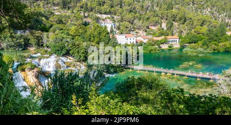 Aerial view of waterfall Skradinski Buk, Croatia. National nature park Krka. View of wooden bridge with tourists. Fresh green nature. Stock Photo