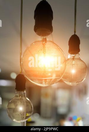 incandescent light bulb, incandescent lamp or incandescent light globe on dark background Stock Photo