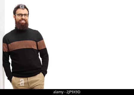 Man in a turtleneck cardigan leaning on a wall isolated on white background Stock Photo