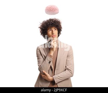 Young pensive man with a brain above his head isolated on white background Stock Photo