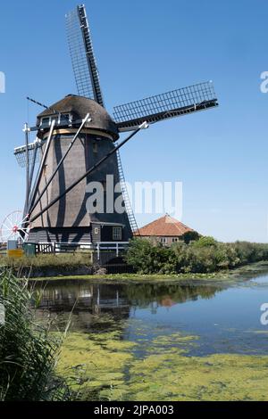The 'Rietveldse Molen’ is a polder mill near Hazerswoude-Dorp in the Dutch municipality of Alphen aan den Rijn Stock Photo