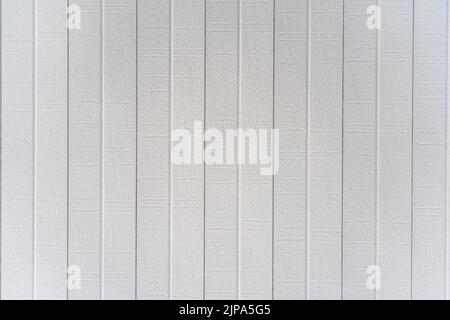 White aluminum patio cover finishing in a embossed faux wood grain texture Stock Photo