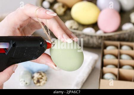 How to make hanging Easter eggs. Step by step, tutorial. Festive decor Stock Photo