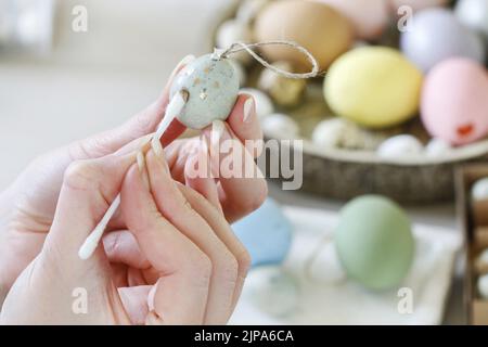 How to make hanging Easter eggs. Step by step, tutorial. Festive decor Stock Photo
