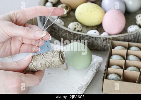 How to make hanging Easter eggs. Step by step, tutorial. Festive decor Stock Photo