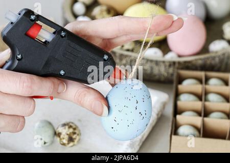 How to make hanging Easter eggs. Step by step, tutorial. Festive decor Stock Photo