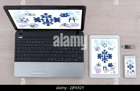 Strategic alliance concept shown on different information technology devices Stock Photo