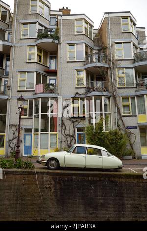 A classic 1970's Citroen DS Super saloon parked in an Amsterdam Street. The car is from circa 1973, the  paintwork is very light green. Stock Photo