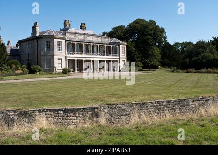 dh Country house NEWTON KYME YORKSHIRE English lawns Ha ha sunken wall vertical walls a garden lawn exterior uk manor mansion Stock Photo