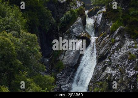 Photograph of Aber falls waterfall, Snowdonia National Park, North Wales.  Shown is a section near the top of the falls taken from the bottom. Stock Photo