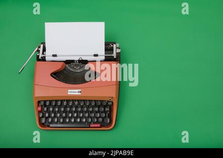 Photograph of a 1970's Underwood 20 typewriter on chroma green background. Stock Photo