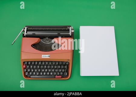 Photograph of a 1970's Underwood 20 typewriter on chroma green background. Stock Photo