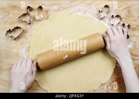 Preparing easter gingerbread cookies. Steps of making pastry. Festive dessert Stock Photo