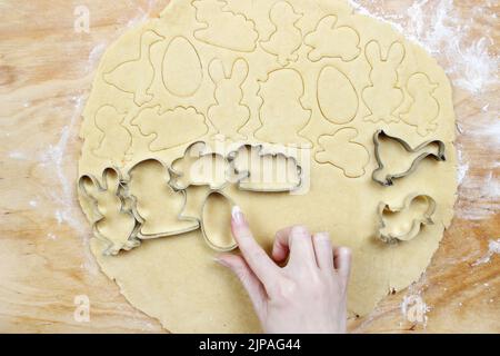 Preparing easter gingerbread cookies. Steps of making pastry. Festive dessert Stock Photo