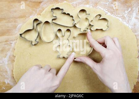 Preparing easter gingerbread cookies. Steps of making pastry. Festive dessert Stock Photo