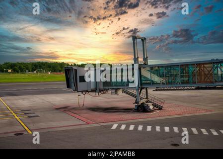 Jet bridge from an airport terminal gate. Stock Photo