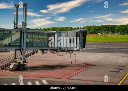 Jet bridge from an airport terminal gate. Stock Photo