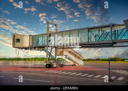 Jet bridge from an airport terminal gate. Stock Photo