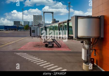 Jet bridge from an airport terminal gate. Stock Photo