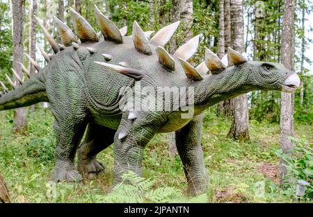 Close-up of a robotic dinosaur of the stegosaurus species in an amusement park Stock Photo