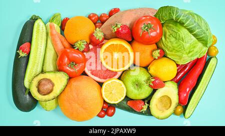 Ripe fresh fruits and vegetables arrangement on pastel cyan background. Flat lay. Healthy diet lifestyle Stock Photo