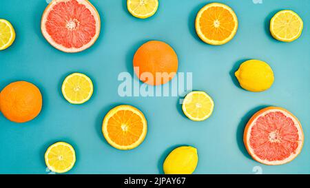 Summer creative oranges, lemons and grapefruits pattern on bluebackground. Tropic citrus fruits concept. Flat lay Stock Photo