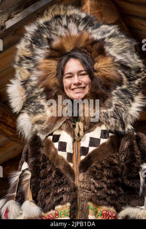 An Athabaskan Girl poses in native costume at the Chena Indian Village in Fairbanks, Alaska Stock Photo