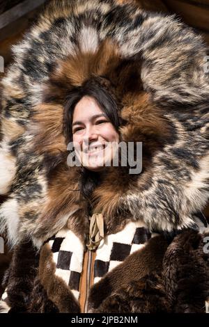 An Athabaskan Girl poses in native costume at the Chena Indian Village in Fairbanks, Alaska Stock Photo