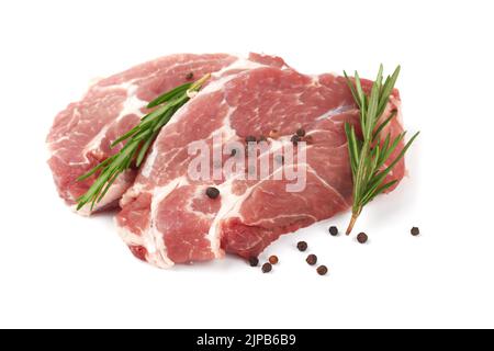 Raw meat with rosemary on a white background Stock Photo