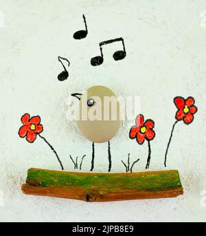 Handmade creative concept with bird made of stone and painted flowers on white background Stock Photo