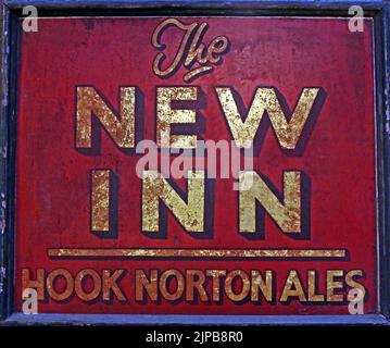 The New Inn - Hook Norton Ales classic pub sign, Oxfordshire craft ales, Hook Norton, Banbury, Oxen, England, UK,  OX15 5NY Stock Photo