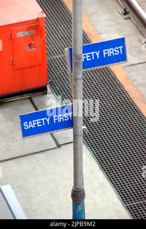 Railroad train yard with sidings and switchers and engines and cars and repair facilities in Utah Safety First signs Stock Photo