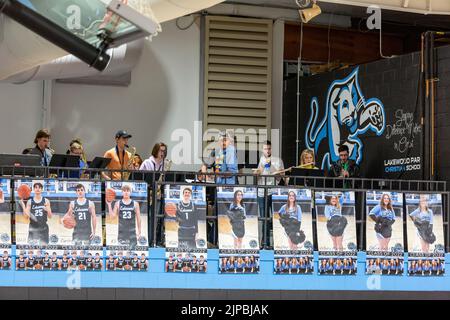 The high school band plays above banners honoring senior athletes during a sporting event at Lakewood Park Christian School in Auburn, Indiana, USA. Stock Photo