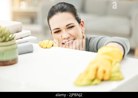 Spring cleaning, chores and sanitize for a clean, hygiene and fresh home while doing housework. Happy woman, cleaner and housekeeper wiping to Stock Photo