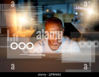 Concentrating on cracking the code. a computer programmer looking through data in the office. Stock Photo