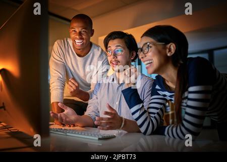Yes you did it. computer programmers working together late in the office. Stock Photo