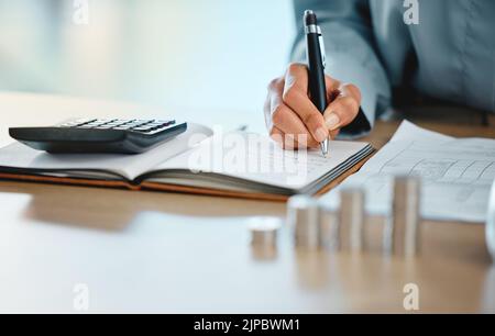 Closeup of auditor, banker and business finance accountant hands analyzing, calculating and recording tax calculations. Woman working on calculator to Stock Photo