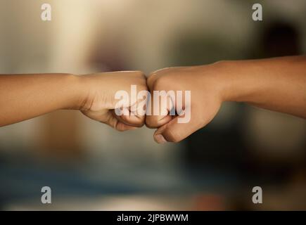 Power, teamwork and solidarity fist bump gesture of people showing support, success or achieving goal. Celebrating, winning hands doing greeting as Stock Photo