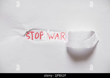 Written text stop war on white paper, protest action, no war between Russia and Ukraine. Stop war, protest action 2022 Stock Photo