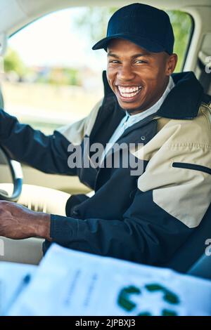 Off to do some rounds. Portrait of a courier driving a delivery van. Stock Photo