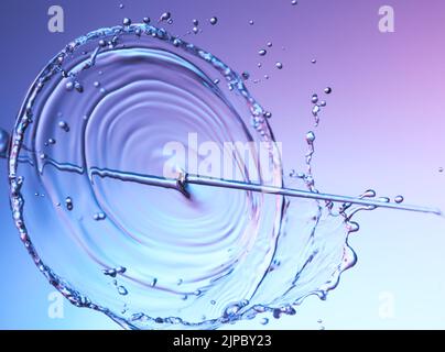 Clear water liquid splash on a red blue background Stock Photo