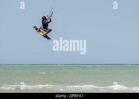 Kiteboarding progression, Man learning basic jumps kitesurfing, , surf, kite surf. Kite boarding jump, boy jumping Stock Photo