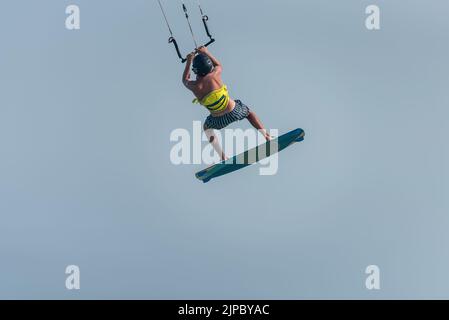 Kiteboarding progression, Man learning basic jumps kitesurfing, , surf, kite surf. Kite boarding jump, boy jumping Stock Photo