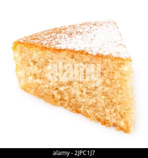 Wedge of lemon sponge cake with icing sugar topping isolated on white. Stock Photo