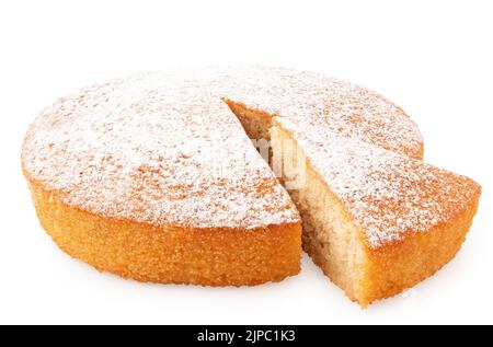 Whole lemon sponge cake with icing sugar topping and cut out wedge isolated on white. Stock Photo
