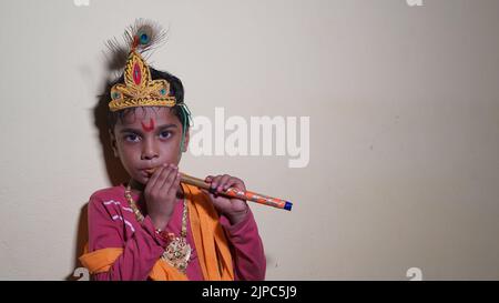 Child dressed as Lord Sri Krishna on the Janmashtami festival or Ashtamirohini day for the procession Stock Photo