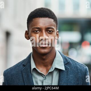 Portrait of a serious business man standing with a vision for innovation in the city alone. Male entrepreneur or worker on a mission and ambition for Stock Photo