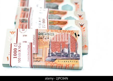 Stacks of the new first Egyptian 10 LE EGP ten pounds plastic polymer banknote features Administrative capital's grand mosque Al-Fattah Al-Aleem, the Stock Photo