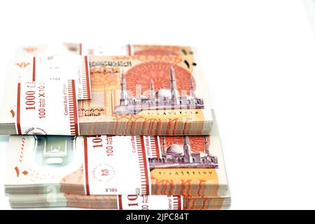 Stacks of the new first Egyptian 10 LE EGP ten pounds plastic polymer banknote features Administrative capital's grand mosque Al-Fattah Al-Aleem, the Stock Photo