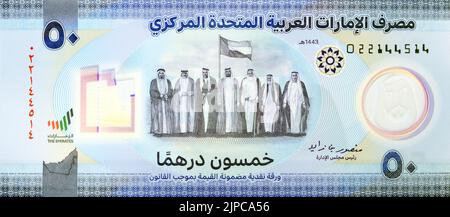 Large Fragment of obverse side of the new polymer commemorative 50 fifty Dirhams with Memorial to the martyrs of the Emirates UAE, seven founding fath Stock Photo